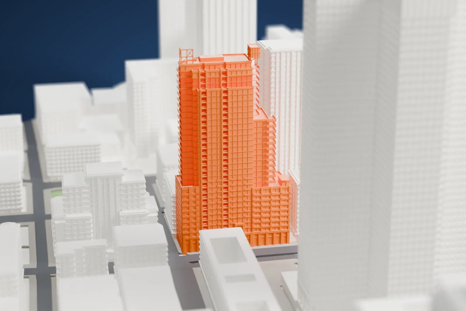 A white 3D print of Altitude Montreal with the surrounding streets and buildings.