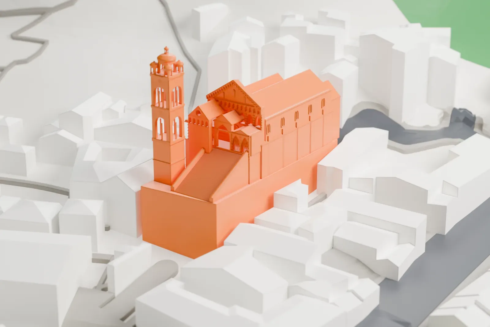 A white 3D print of Amalfi Cathedral on its piazza, with the surrounding buildings of the town around it.