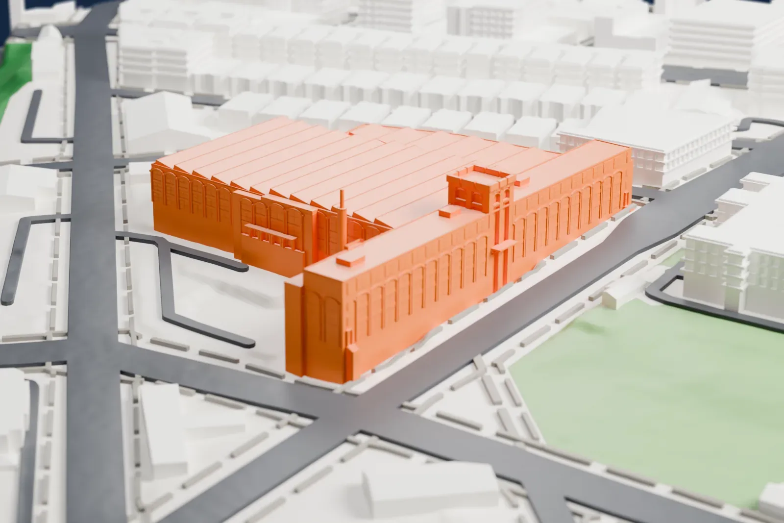 A white 3D print of the American Bank Note Company's printing plant, a large complex with sawtooth roofs and a tower, among streets, a green park and rows of smaller buildings.
