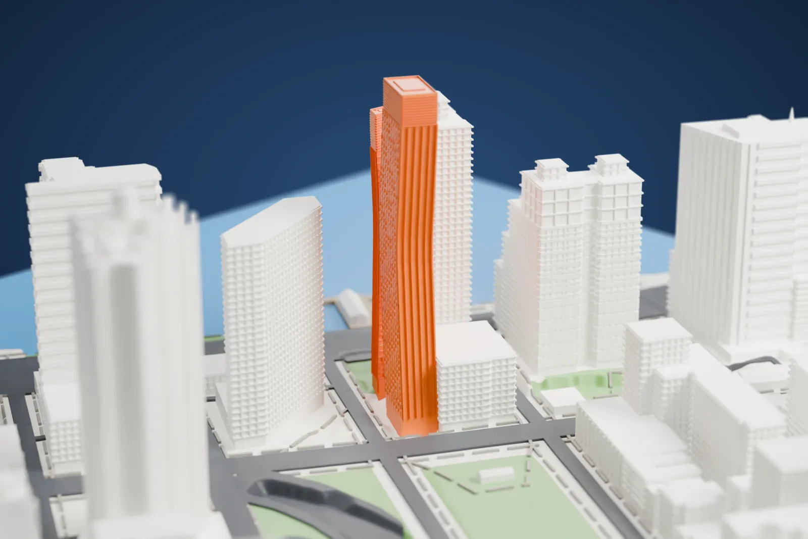 A white 3D print of the American Copper Buildings, two slim towers of different heights leaning toward each other among taller and lower buildings with the water nearby.