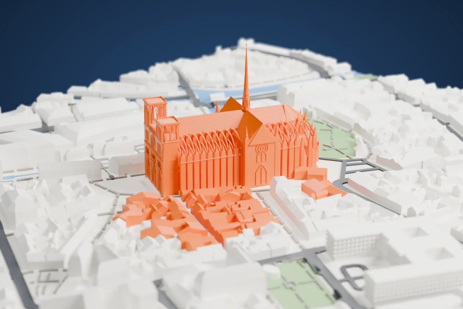 A white 3D print of Amiens Cathedral, with twin west towers, a tall slender central spire and flying buttresses, surrounded by dense buildings, small park areas and narrow waterways.