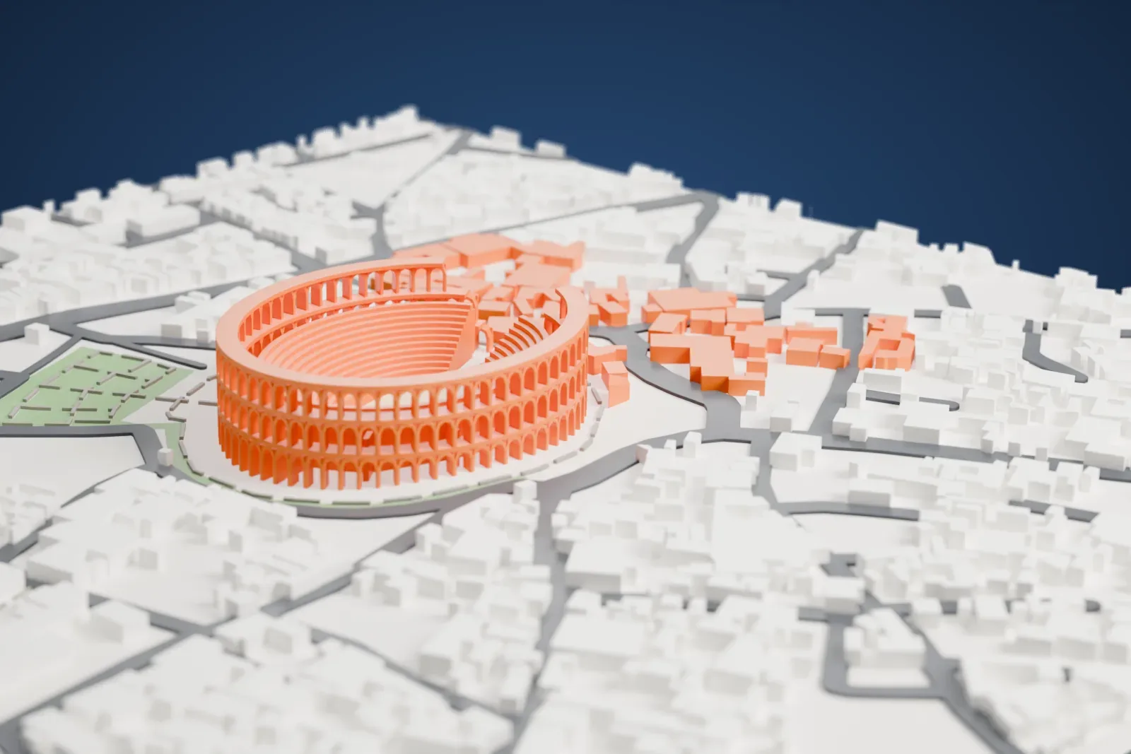A white 3D print of the Amphitheatre of El Jem, an oval ring of tiered arches with a broken section on one side, surrounded by small town buildings, streets and green patches.