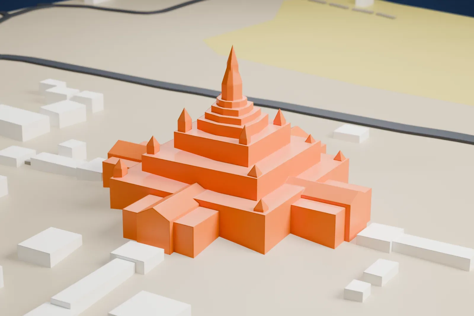 A white 3D print of the Ananda Temple, a cross-shaped temple with stepped terraces and a tall central spire, on open ground with a few low buildings and roads nearby.