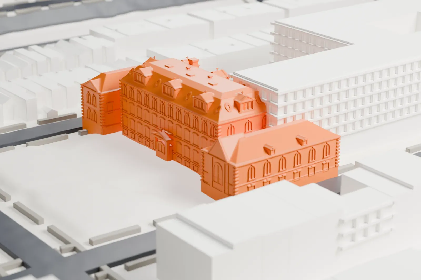 A white 3D print of the Angel Guardian Home, a complex with sloped roofs and dormers around an open lot, with streets and rows of houses nearby.