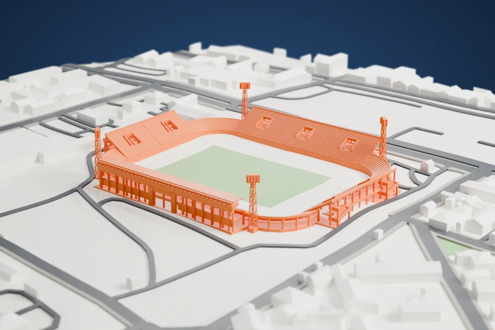 A white 3D print of Antonio Aranda Stadium, a football stadium with a covered main stand, curved terraces and four floodlight masts, surrounded by wide streets and low buildings.