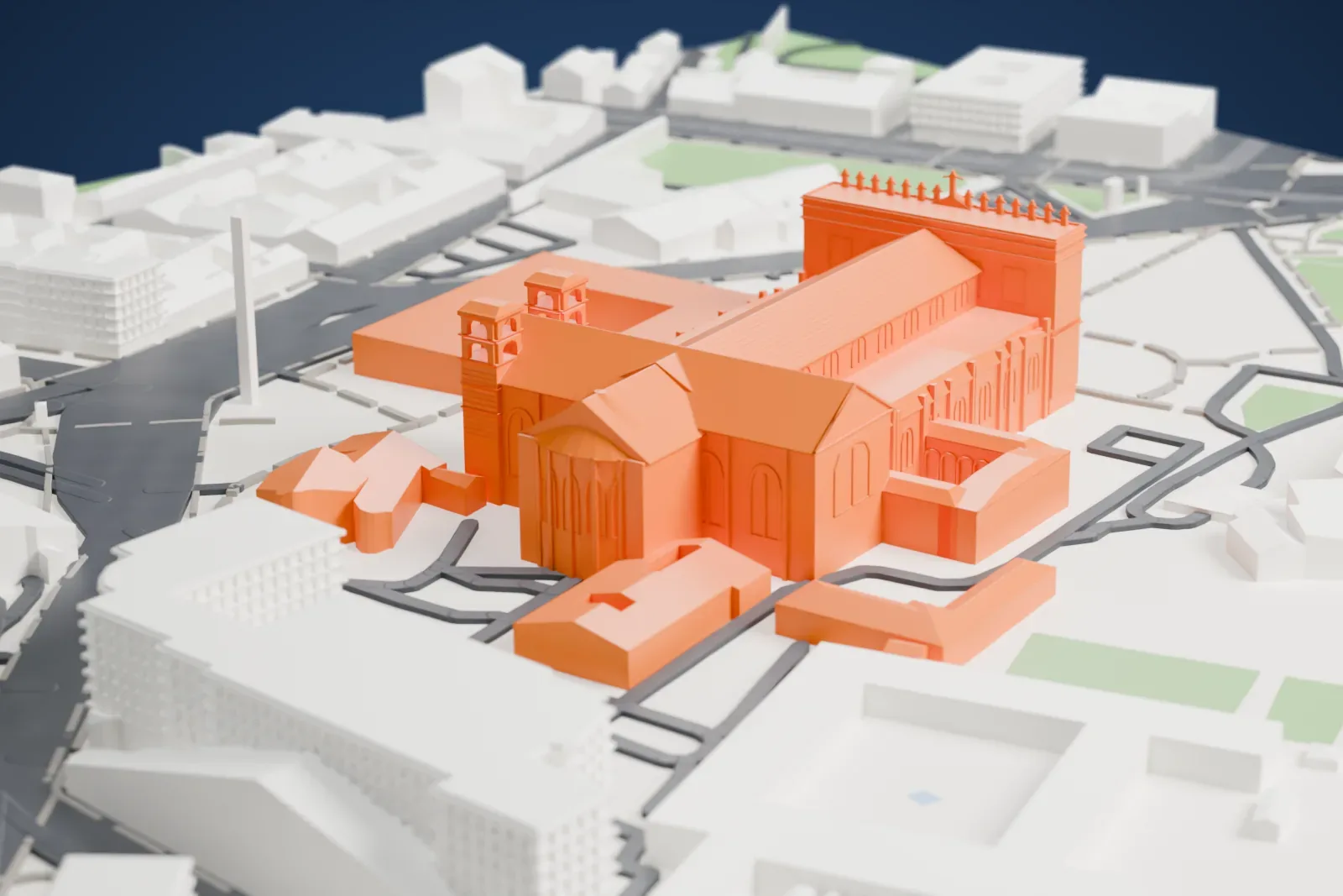 A white 3D print of the Archbasilica of Saint John Lateran, a long church with a ridged nave roof and a tall columned façade, among city blocks, courtyards and patches of green.