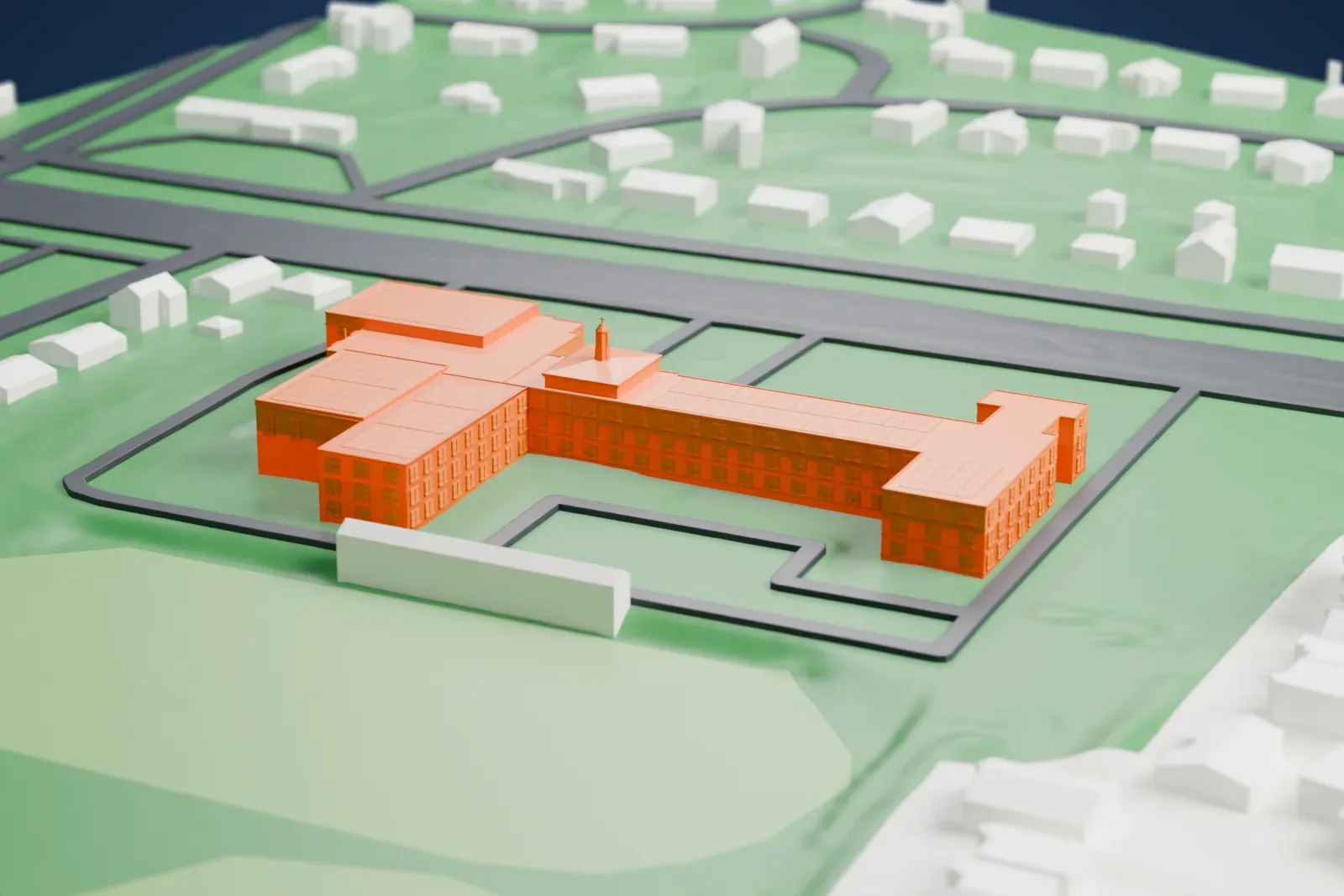 A white 3D print of Archbishop Stepinac High School, a school with long wings, among green fields and houses.