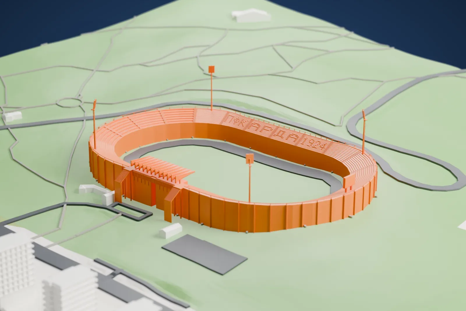 A white 3D print of Arena Arda, an oval stadium with a running track around the pitch and slim floodlight masts, set on grassy parkland with a winding road nearby.