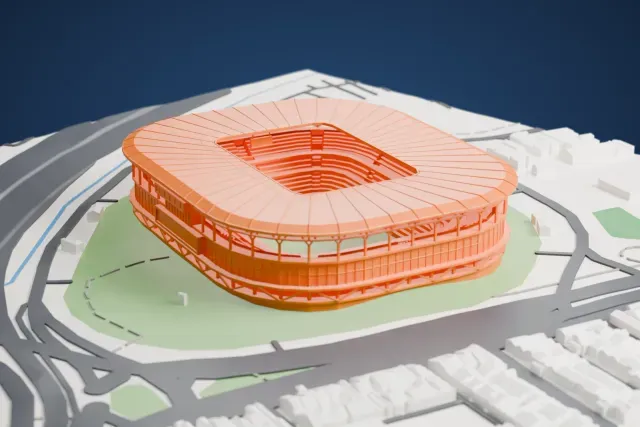 A white 3D print of Arena do Grêmio, a rounded stadium with a ribbed roof, on green grounds ringed by roads and low buildings.