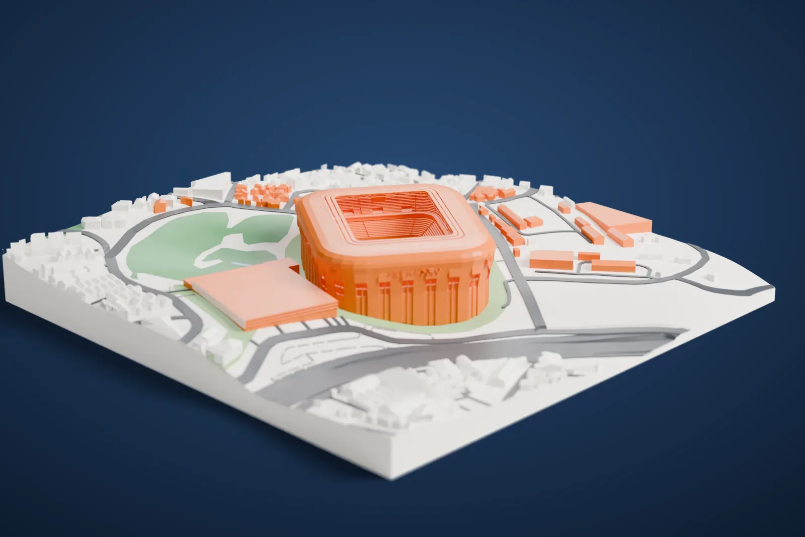 A white 3D print of Arena MRV, a rounded stadium with raised lettering on its facade, surrounded by houses, roads and green areas.