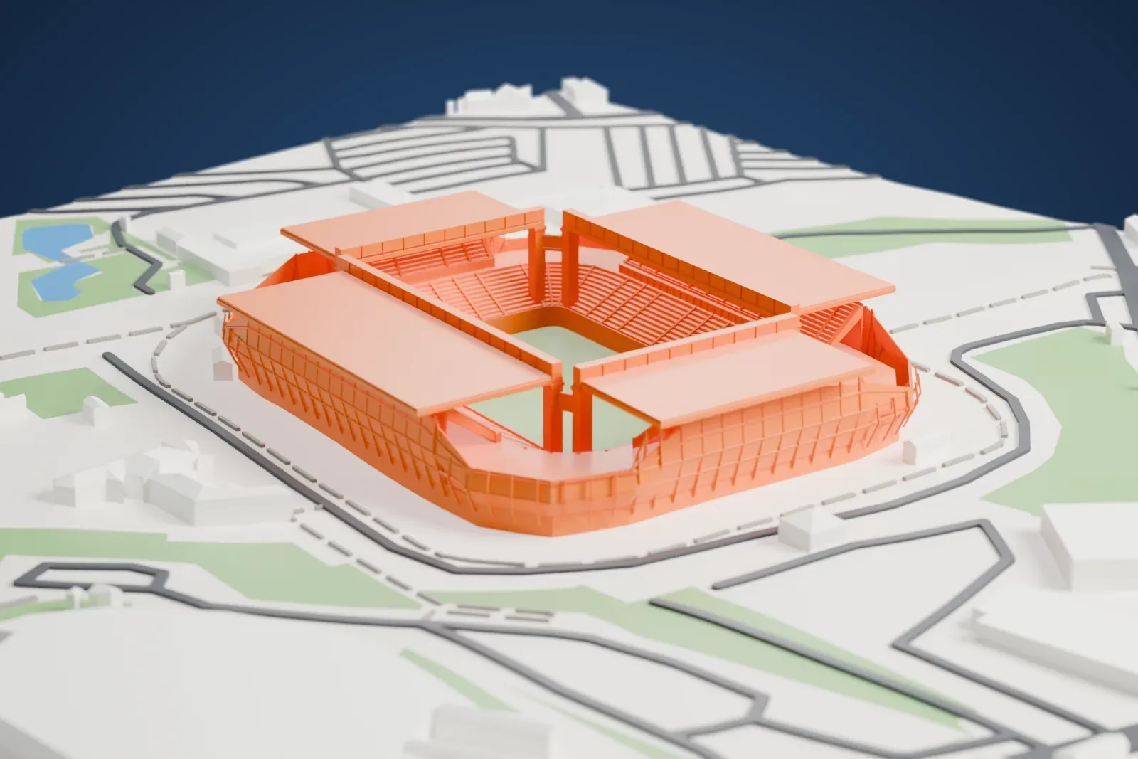 A white 3D print of Arena Pantanal, with four flat roof plates around open corners and paired pillars, among surrounding streets and buildings.