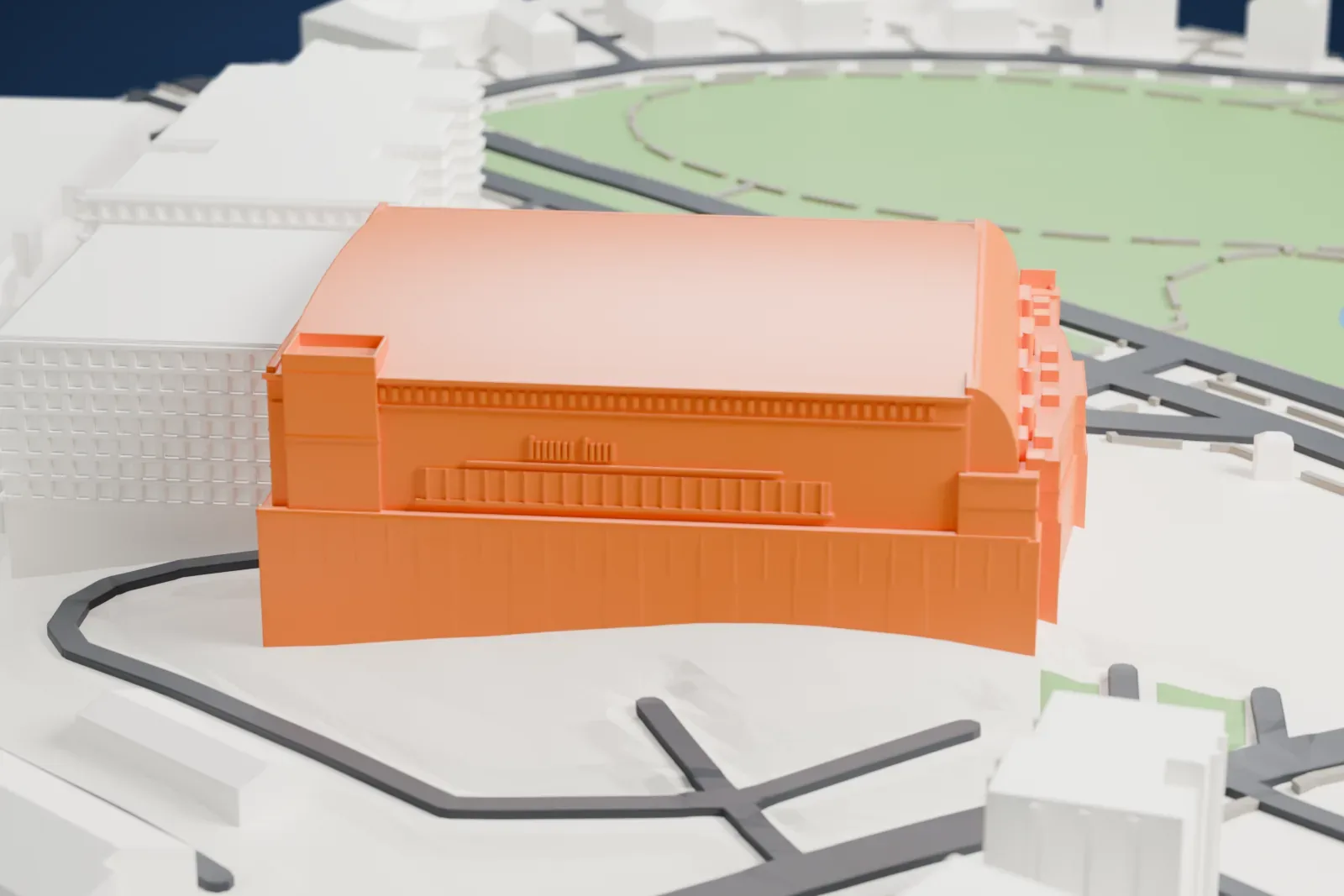 A white 3D print of Arena Vilnius, a low arena with a rounded glass end and a shallow curved roof, among surrounding streets and buildings.