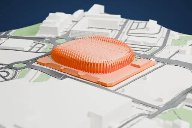 A white 3D print of Arena Zagreb, an oval ribbed arena sitting on a wide base, surrounded by roads, roundabouts and low buildings.
