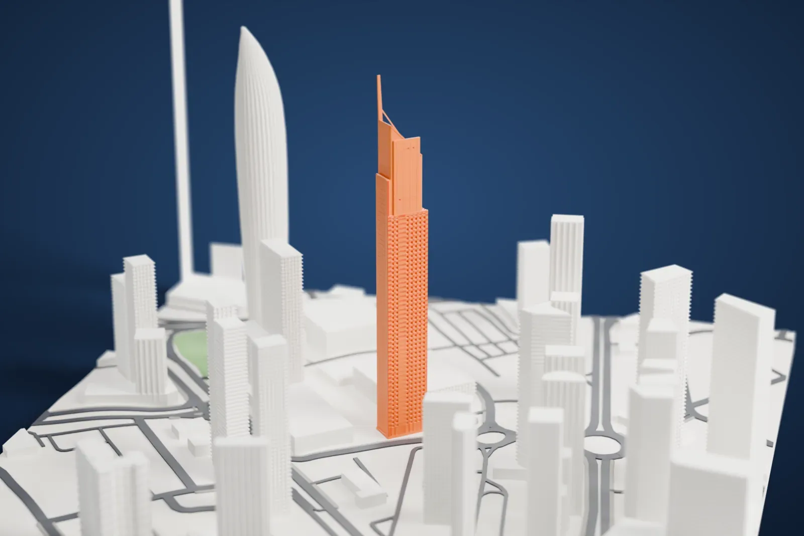 A white 3D print of Arraya Tower, a tall slim tower with diagonal bracing and a slanted top with a thin spire, standing among other tall buildings and streets.