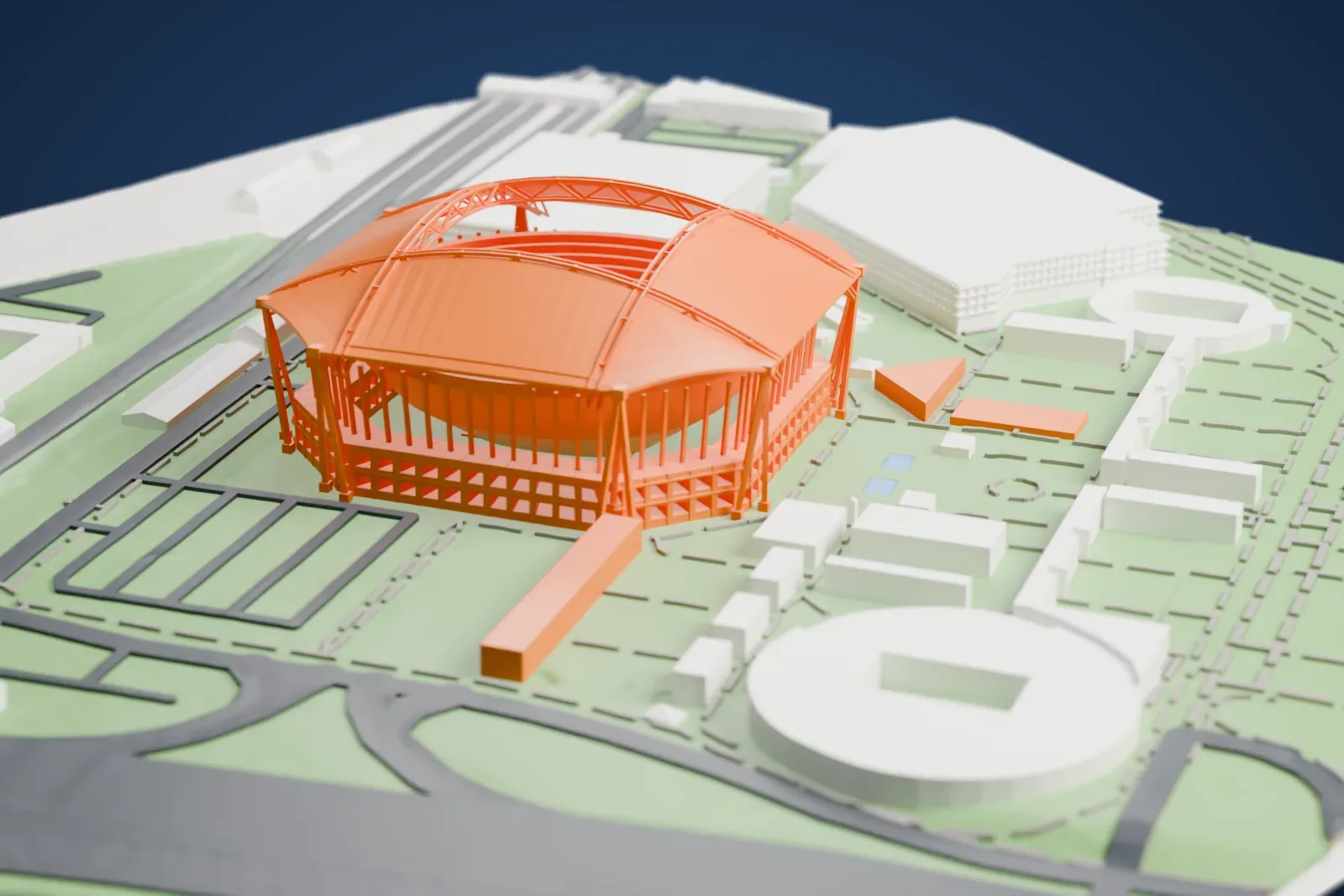 A white 3D print of Arthur Ashe Stadium, a round tennis arena under a curved fabric roof held up by slim columns, with parkland, paths and parking lots around it.