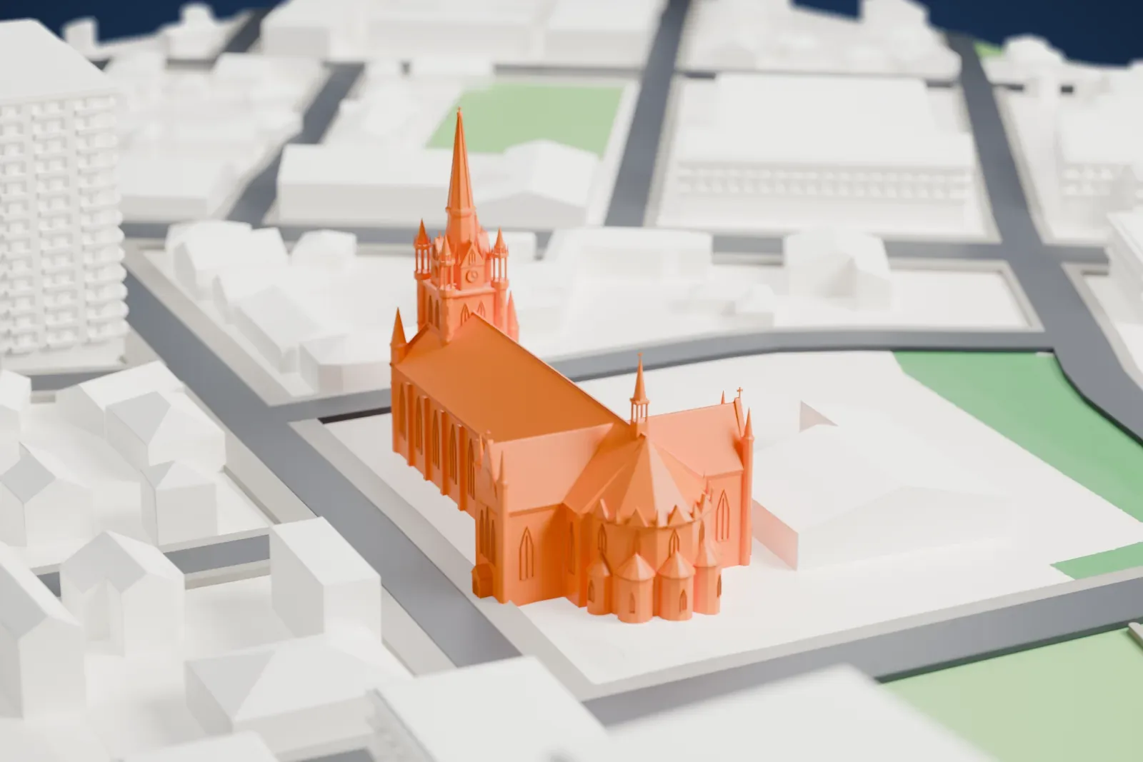 A white 3D print of Assumption Cathedral, a church among surrounding streets and buildings.