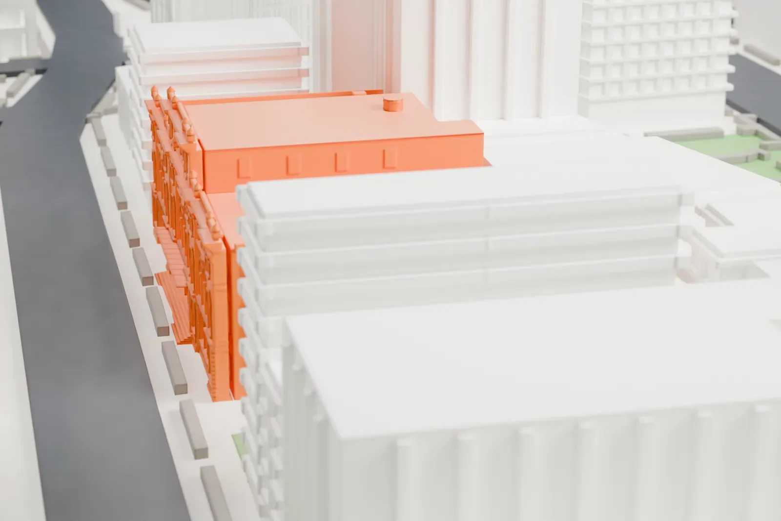 A white 3D print of the Astor Library Building, a wide, low building with arched windows and a decorated cornice, surrounded by taller blocks and a small green park.
