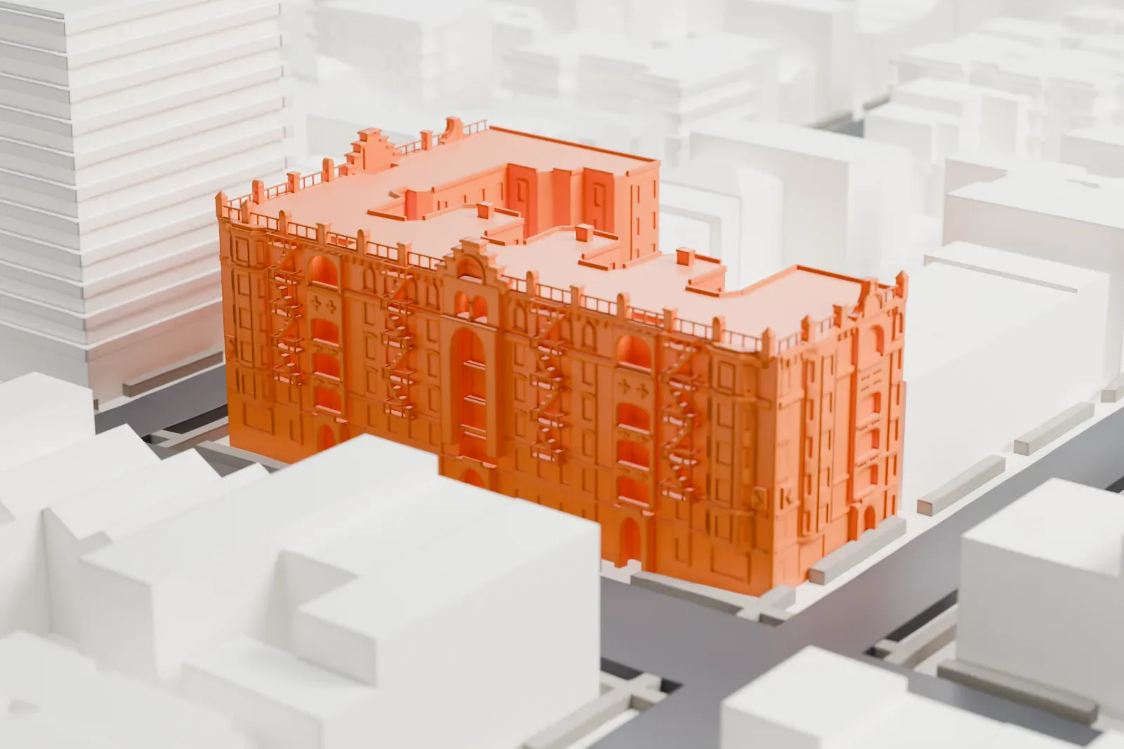 A white 3D print of the Astral Apartments, a block-long building with an ornate roofline and fire escapes, among lower buildings on a street grid.