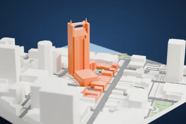 A white 3D print of the AT&T Building (Batman) model in Nashville, with the streets around it.