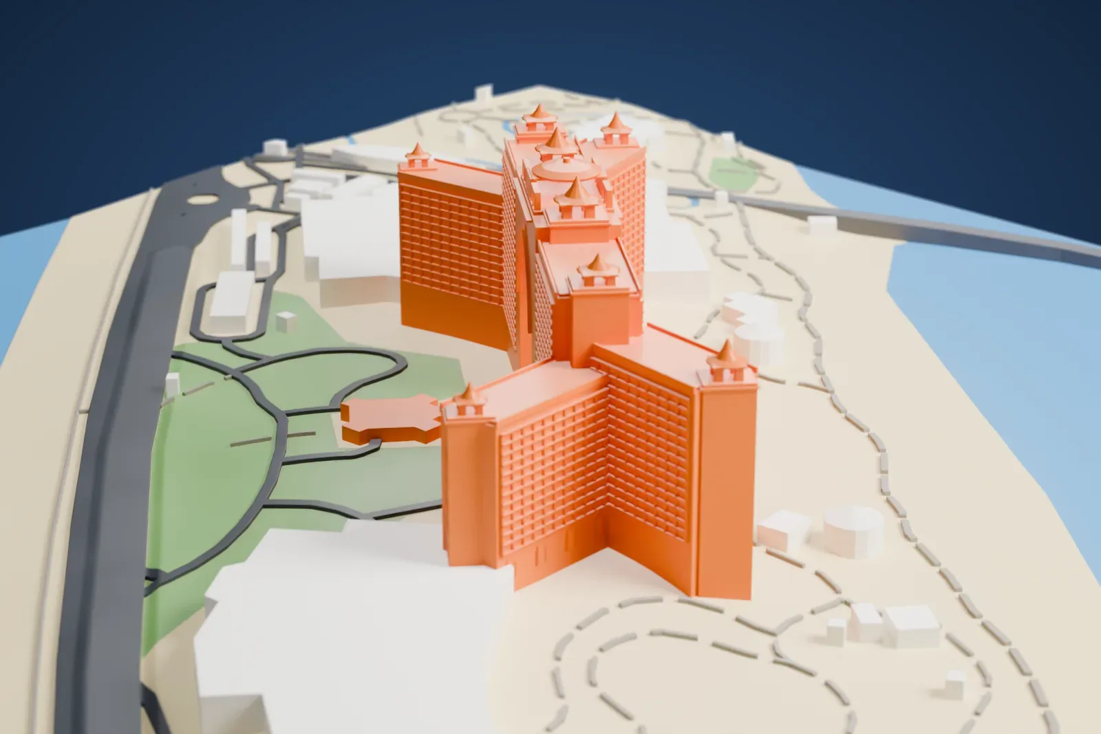 A white 3D print of Atlantis, The Palm, a long hotel with a tall central arch and small conical roof turrets, on a narrow strip of land with water around it.
