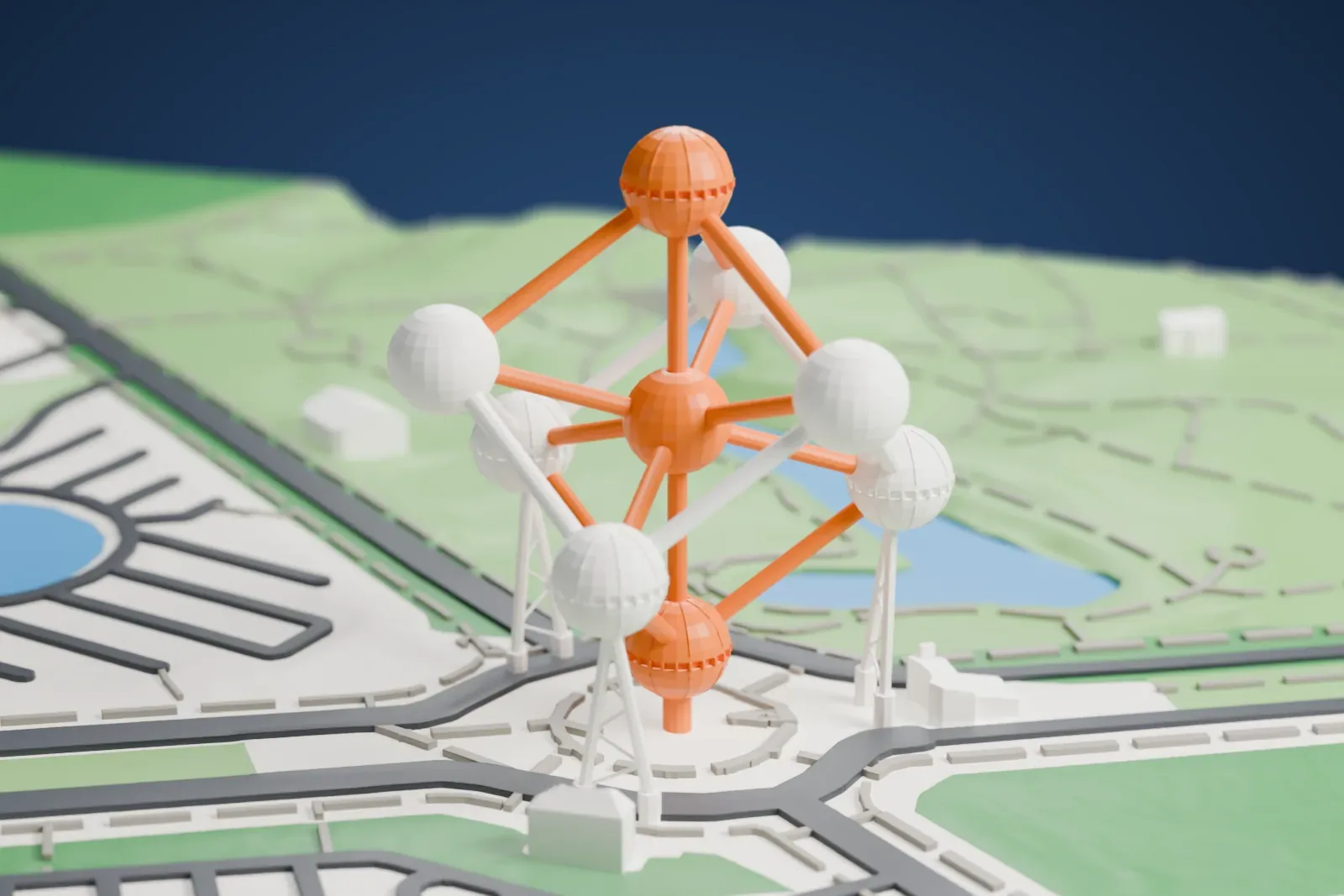 A white 3D print of the Atomium, nine large spheres joined by straight tubes with slim angled legs under the lower spheres, standing among roads, lawns and small ponds.