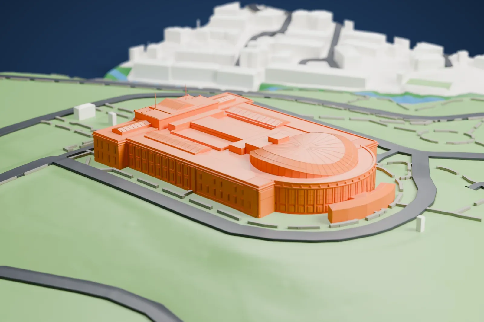 A white 3D print of the Auckland War Memorial Museum, a wide flat-roofed building with a columned front and a domed roof, standing in parkland encircled by a road.