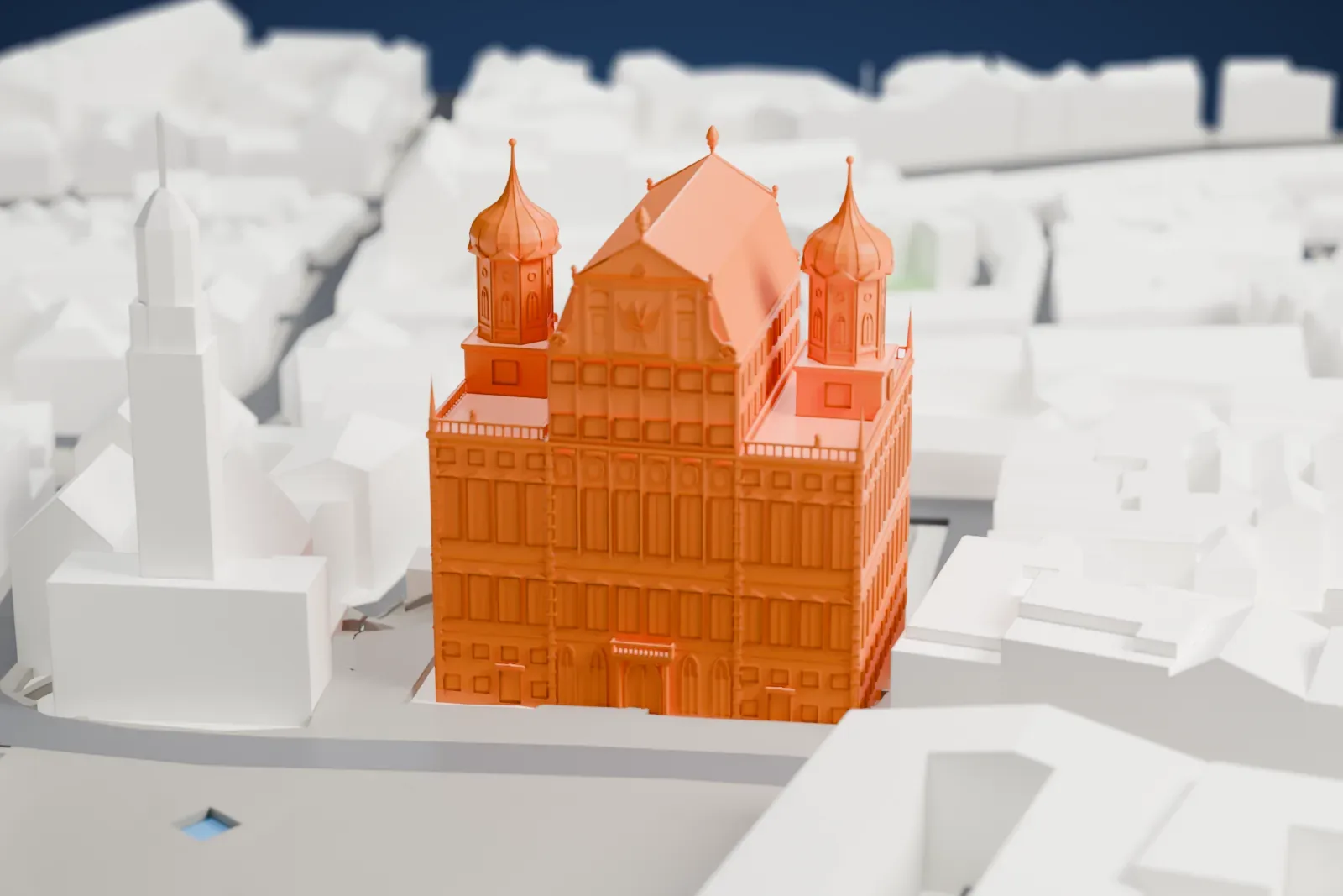 A white 3D print of Augsburg Town Hall, a tall building with two onion domes beside a large gable, surrounded by town buildings and streets.