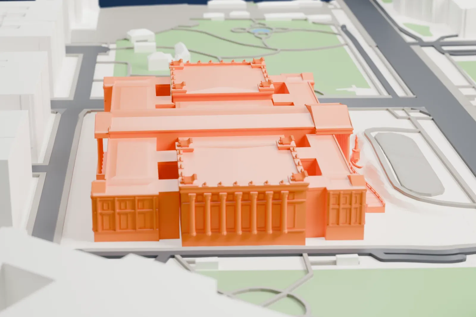 A white 3D print of the Austrian Parliament Building, a long Greek Revival building on the Ringstraße, among the surrounding streets and buildings of central Vienna.