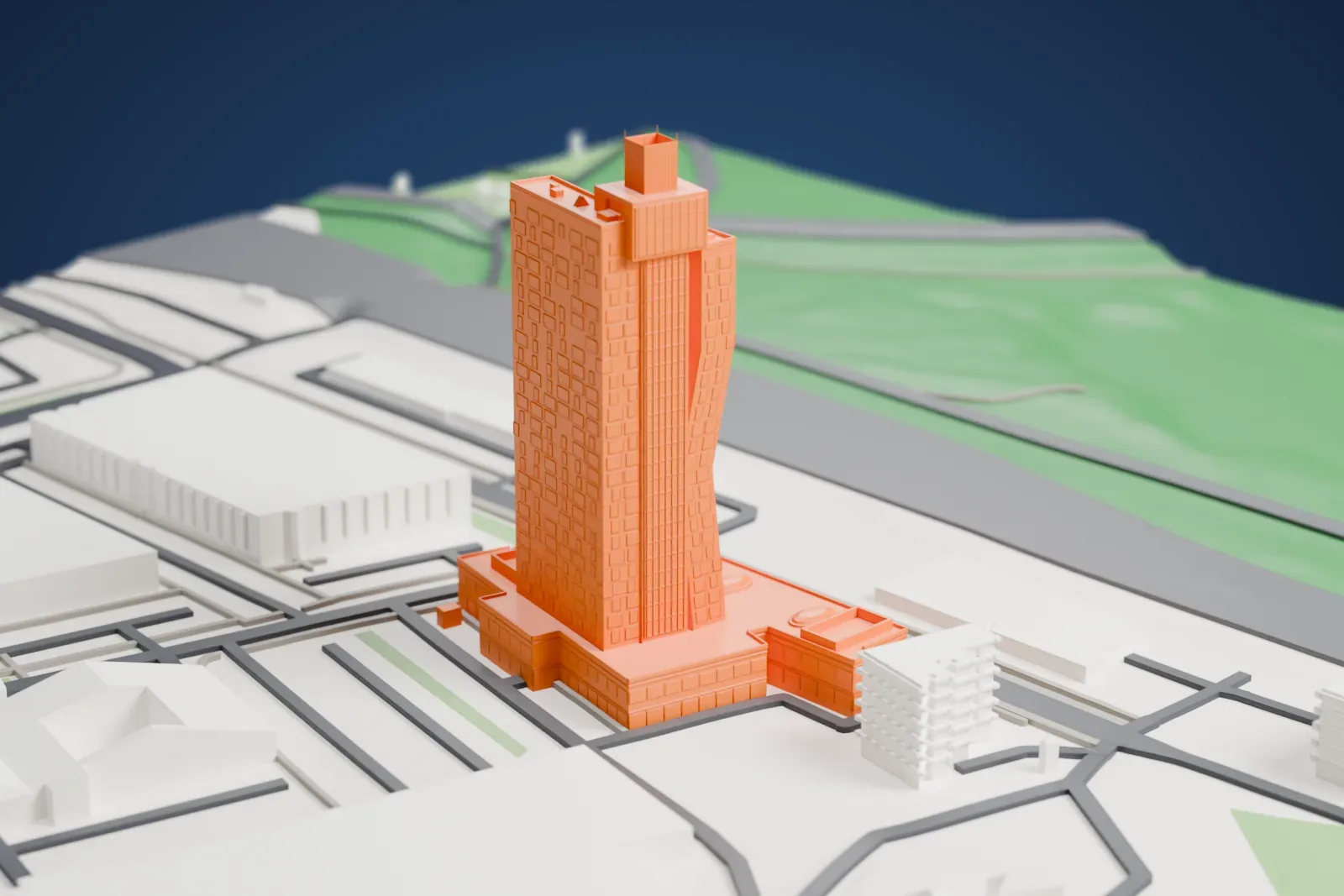A white 3D print of the AZ Tower, a tall bending tower rising from a wide low base, among surrounding streets and buildings.