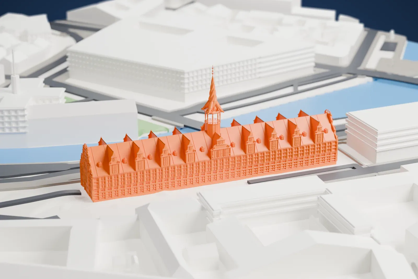 A white 3D print of Børsen, a long brick bourse with a steep roof, repeated gables and a tall spire of twisted dragon tails, in the center of Copenhagen.