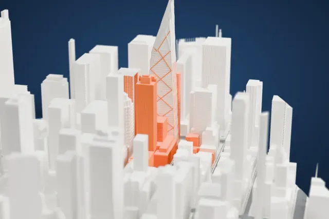A white 3D print of the Baccarat Hotel New York model in New York, with the streets around it.