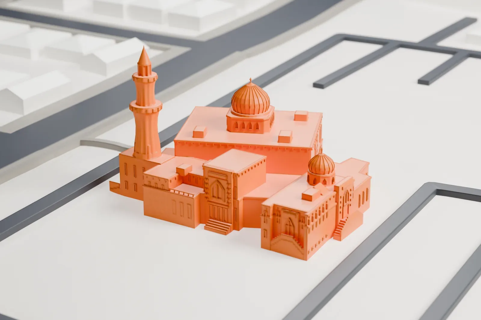 A white 3D print of the Baitul Islam Mosque among the surrounding streets and buildings.