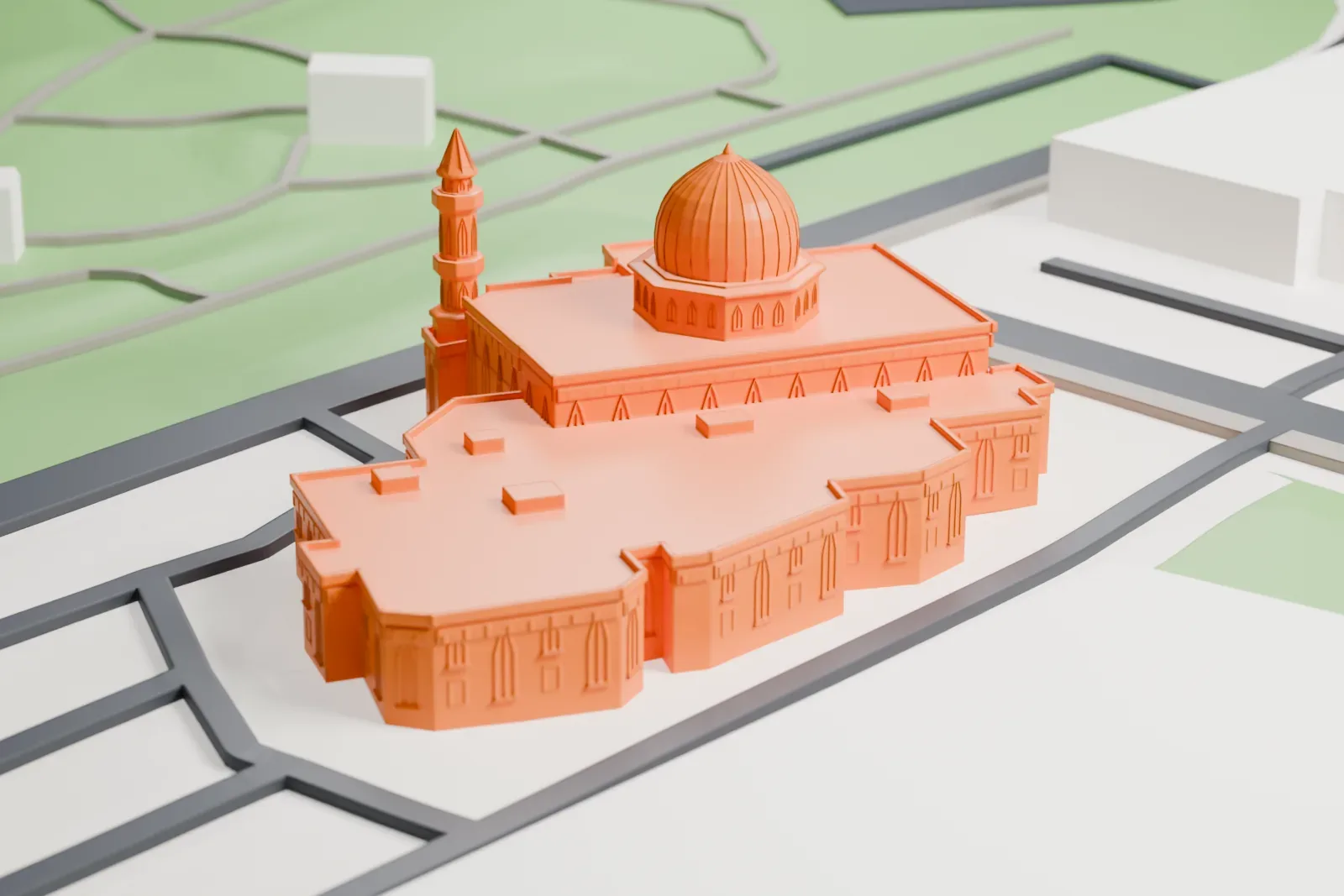 A white 3D print of Baitun Nur Mosque, among the surrounding streets and buildings.