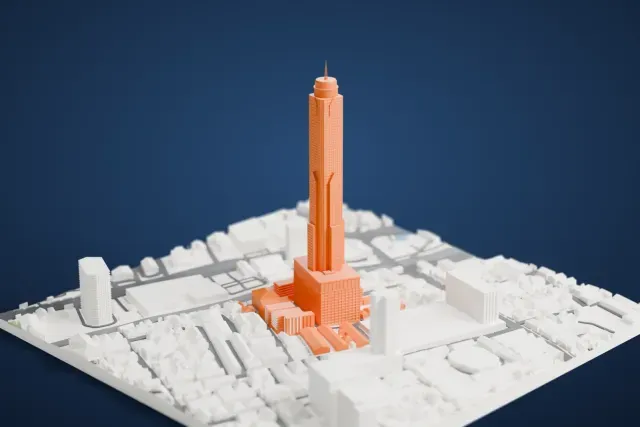 A white 3D print of Baiyoke Tower II, a tall stepped tower with a slim antenna rising from a wide base, surrounded by low Bangkok buildings and roads.