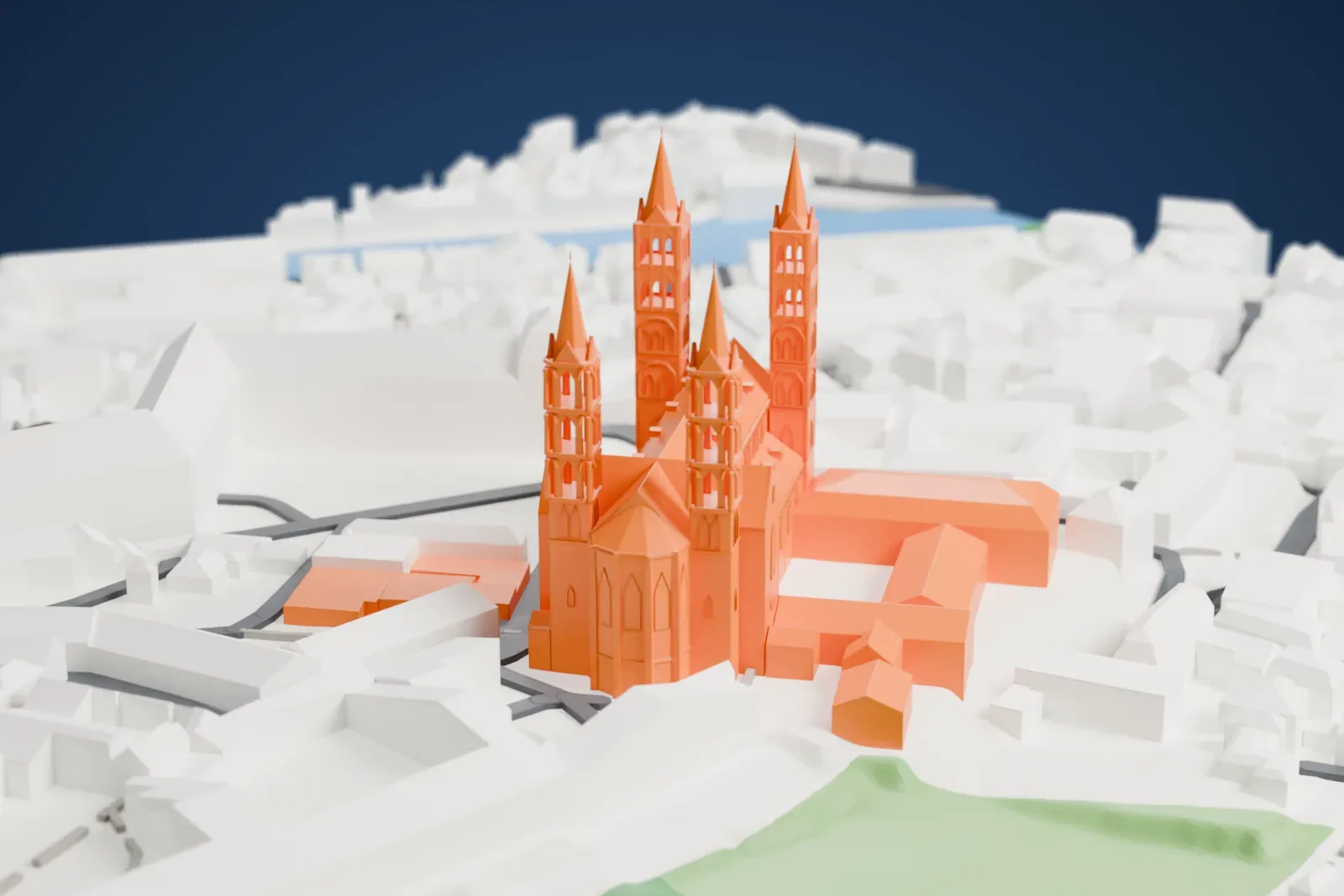 A white 3D print of Bamberg Cathedral, a long church with four tall spired towers, surrounded by closely packed buildings, streets and patches of green.