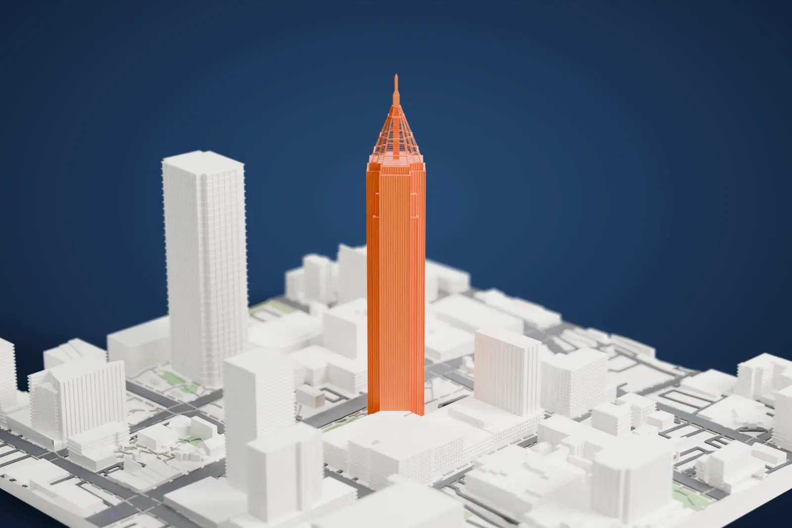 A white 3D print of Bank of America Plaza, a very tall tower with fine vertical ribs and an open lattice pyramid and spire on top, standing among lower buildings and streets.