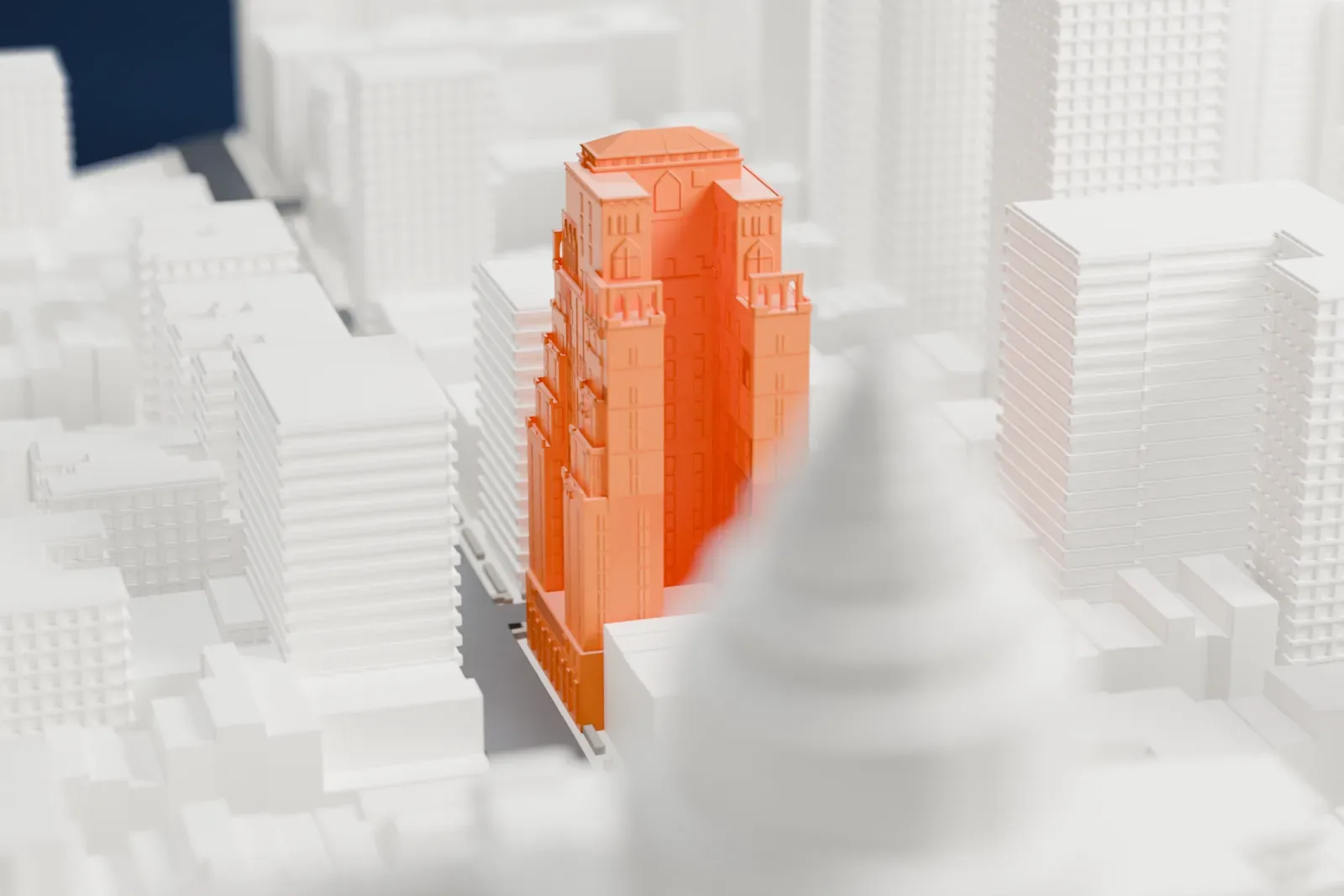 A white 3D print of Barbizon 63, a tall tower with stepped setbacks and a small pyramid roof, among taller and shorter Upper East Side buildings.