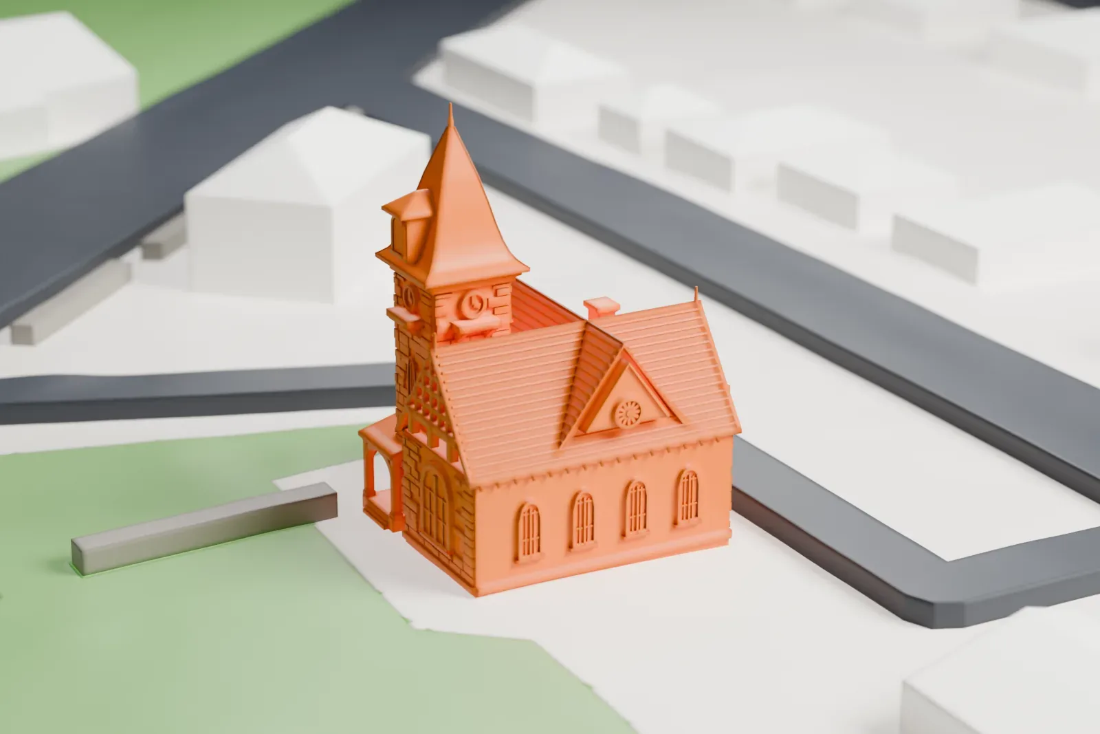 A white 3D print of the Barron Library, a gabled building with a tall pointed tower and a rounded bay, standing on a green lawn beside a street.