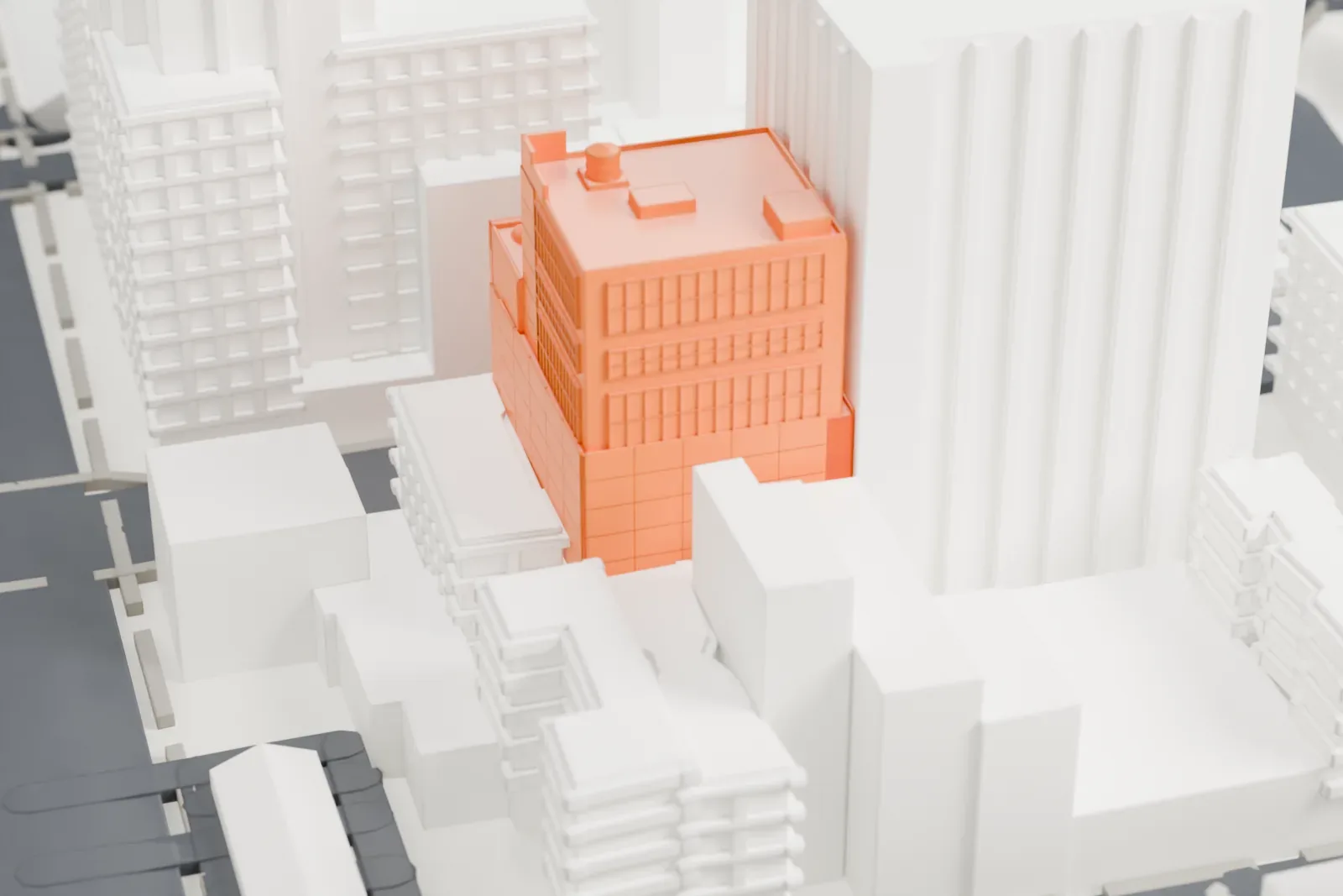A white 3D print of the Baryshnikov Arts Center, a narrow building with bands of large windows and a small water tank on its roof, standing between taller buildings.