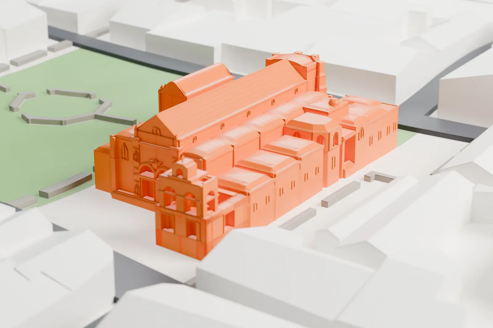 A white 3D print of the Basilica Cathedral of Santa María la Menor with its pitched roof and bell tower, beside a green space and surrounded by streets and buildings.
