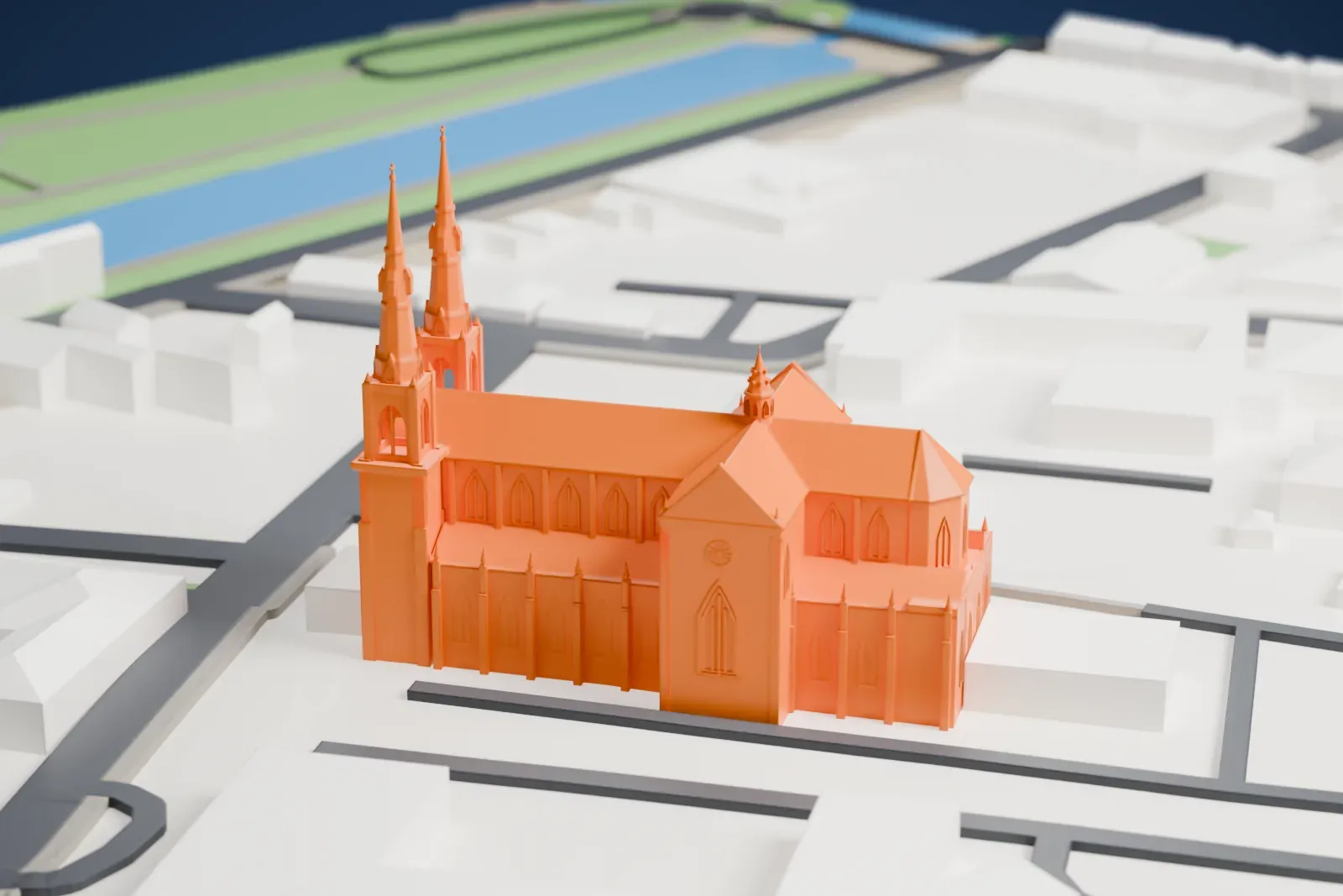 A white 3D print of the Basilica Cathedral of St. Cecilia with the surrounding streets and buildings.