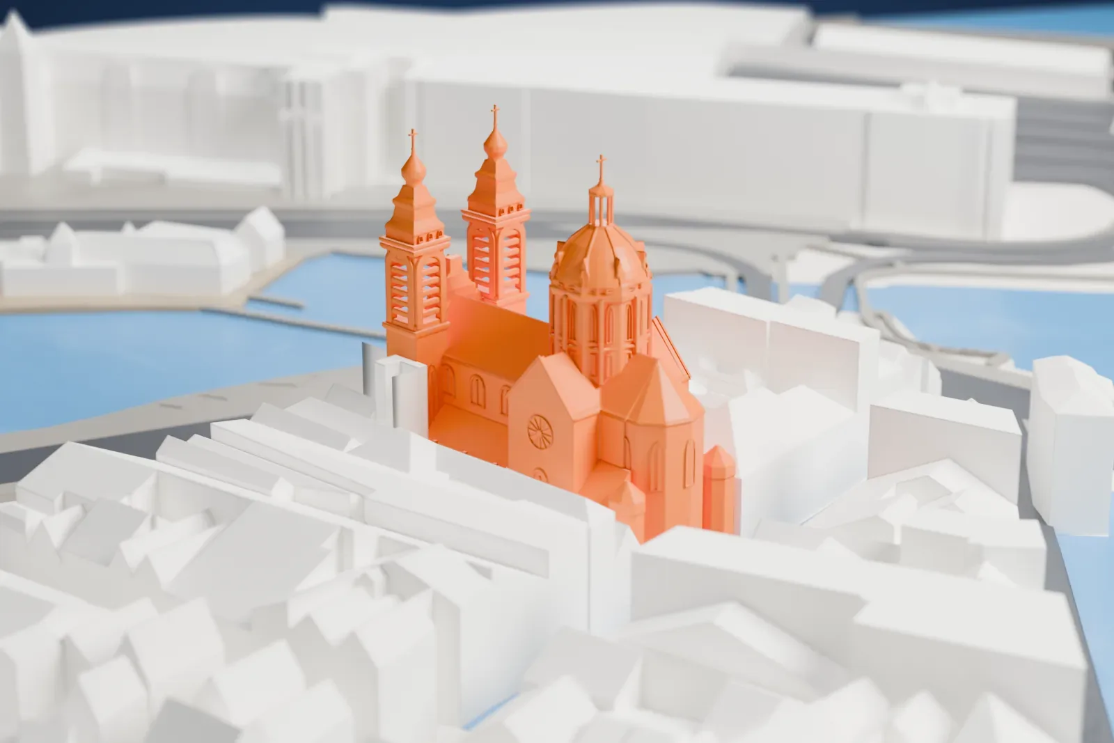 A white 3D print of the Basilica of Saint Nicholas, with its church body and towers among surrounding streets and buildings.