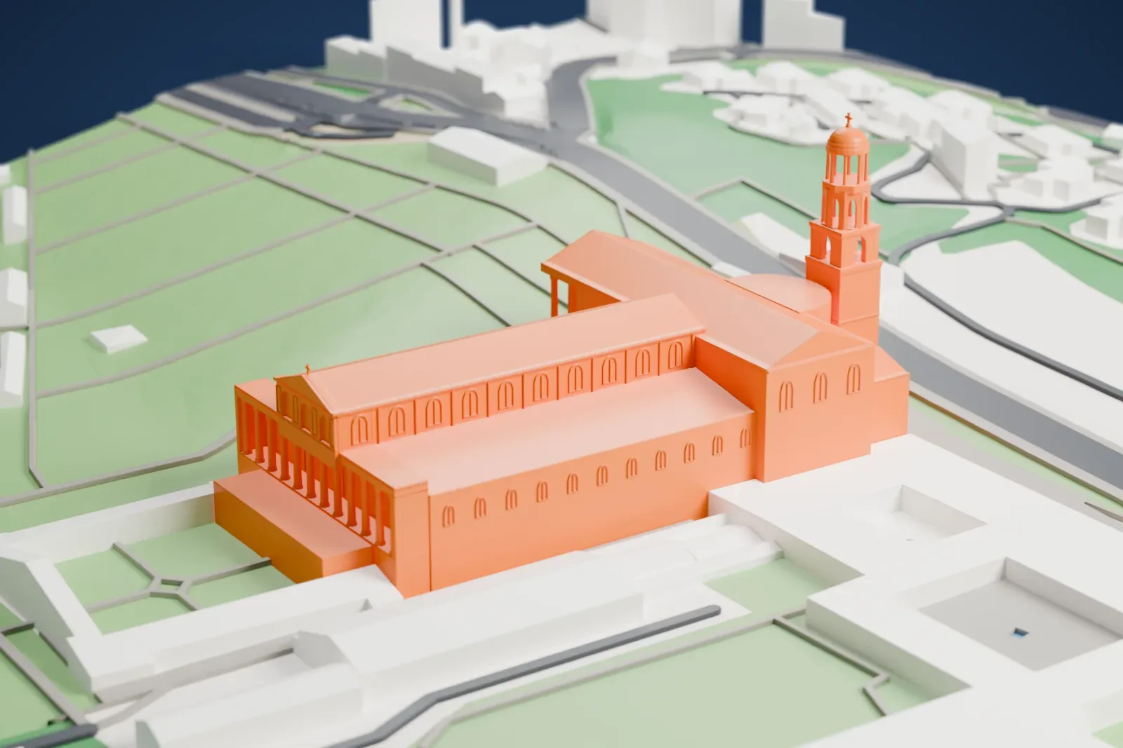 A white 3D print of the Basilica of St. Paul Outside the Walls, its long roof and façade standing among the surrounding streets and buildings of Rome.