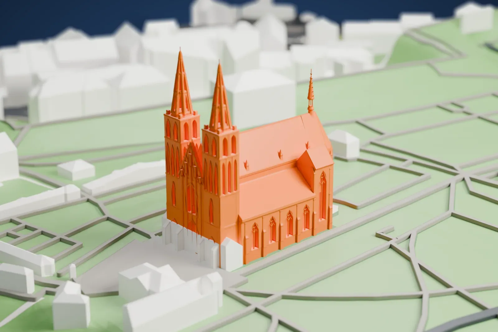 A white 3D print of the Basilica of St. Peter and St. Paul in Prague, with its twin towers and the Vyšehrad park and cemetery.