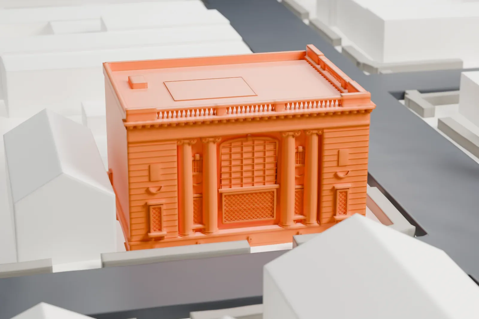 A white 3D print of the Bayonne Community Museum, a two-story stone building with a columned front and a flat roof, surrounded by low buildings and streets.