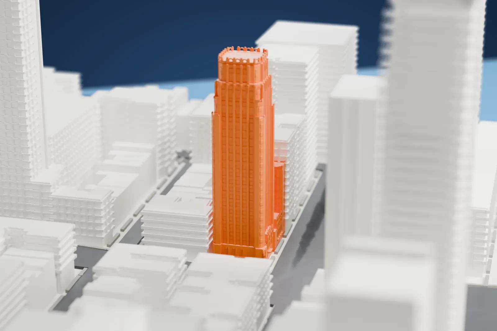 A white 3D print of the Beekman Tower, a tall stepped tower with a crowned top, standing among taller and shorter buildings near a green park.