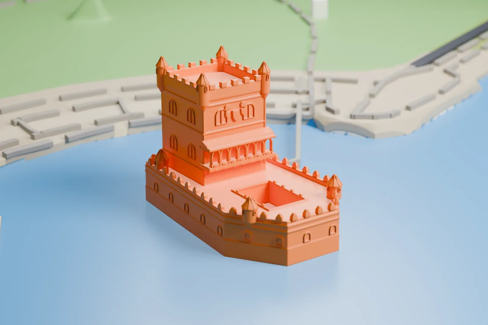 A white 3D print of Belém Tower, a crenellated tower with corner turrets rising from a low bastion, surrounded by water with the shore behind it.