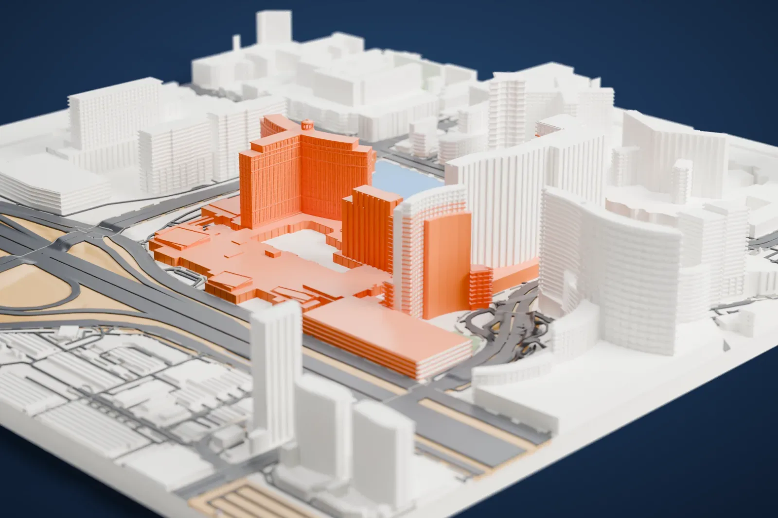 A white 3D print of Bellagio, a curved hotel tower and lower buildings beside a lake, surrounded by tall neighboring buildings and wide roads.