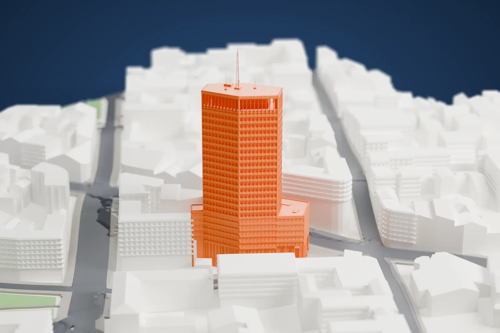 A white 3D print of Beograđanka, a tall high-rise with an antenna mast above a lower wing, set among dense surrounding streets and buildings.