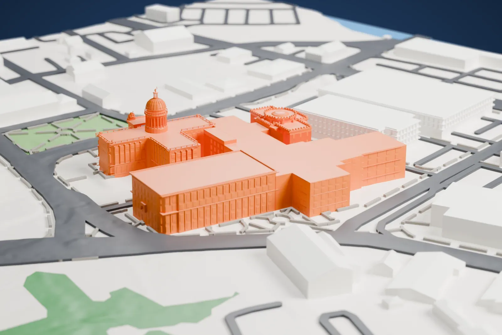 A white 3D print of the Bergen County Court House, a domed rotunda building joined to long wings, among streets, small parks and low buildings.